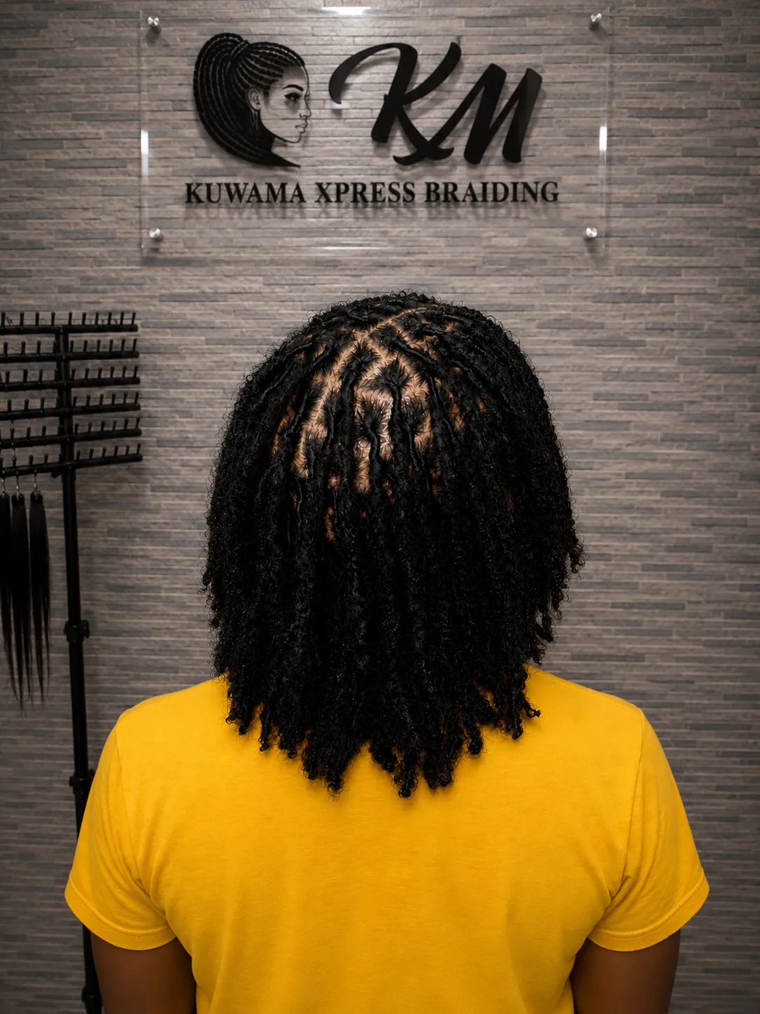 Textured locs styled at Kuwama Xpress Braiding